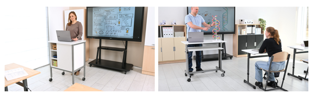 Učitelia vedúci hodinu pri mobilnom pulte s notebookom a interaktívnym monitorom v pozadí.